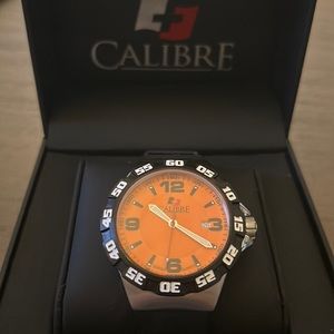CALIBRE Lancer Orange Dial Men’s Watch